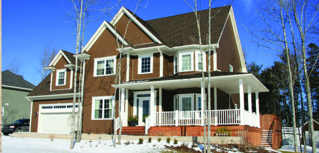 A brown two-storey residential home with white trim.