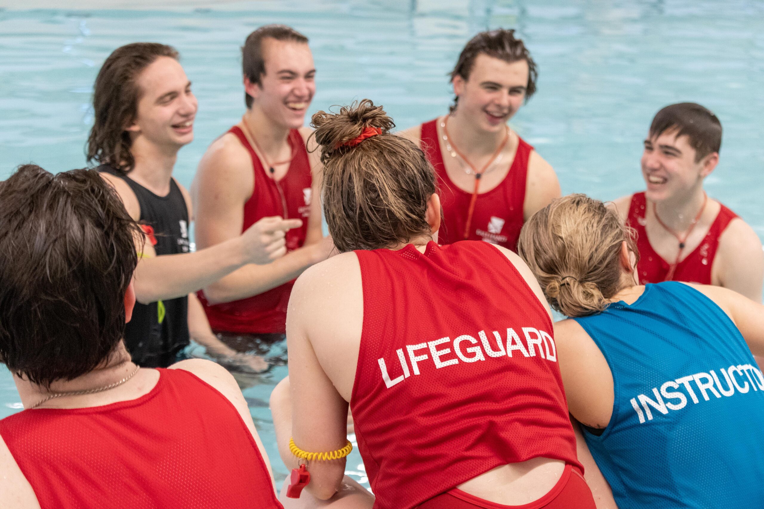 A group of lifeguards and instructors laughing