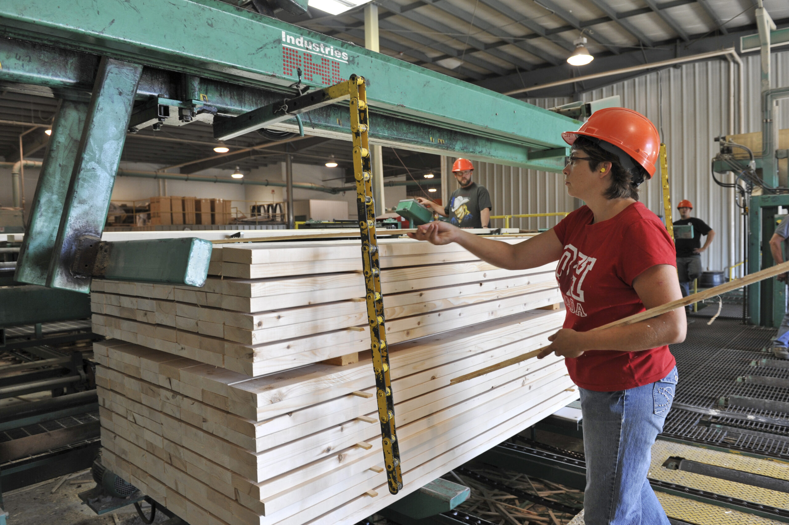 Woman working with lumber