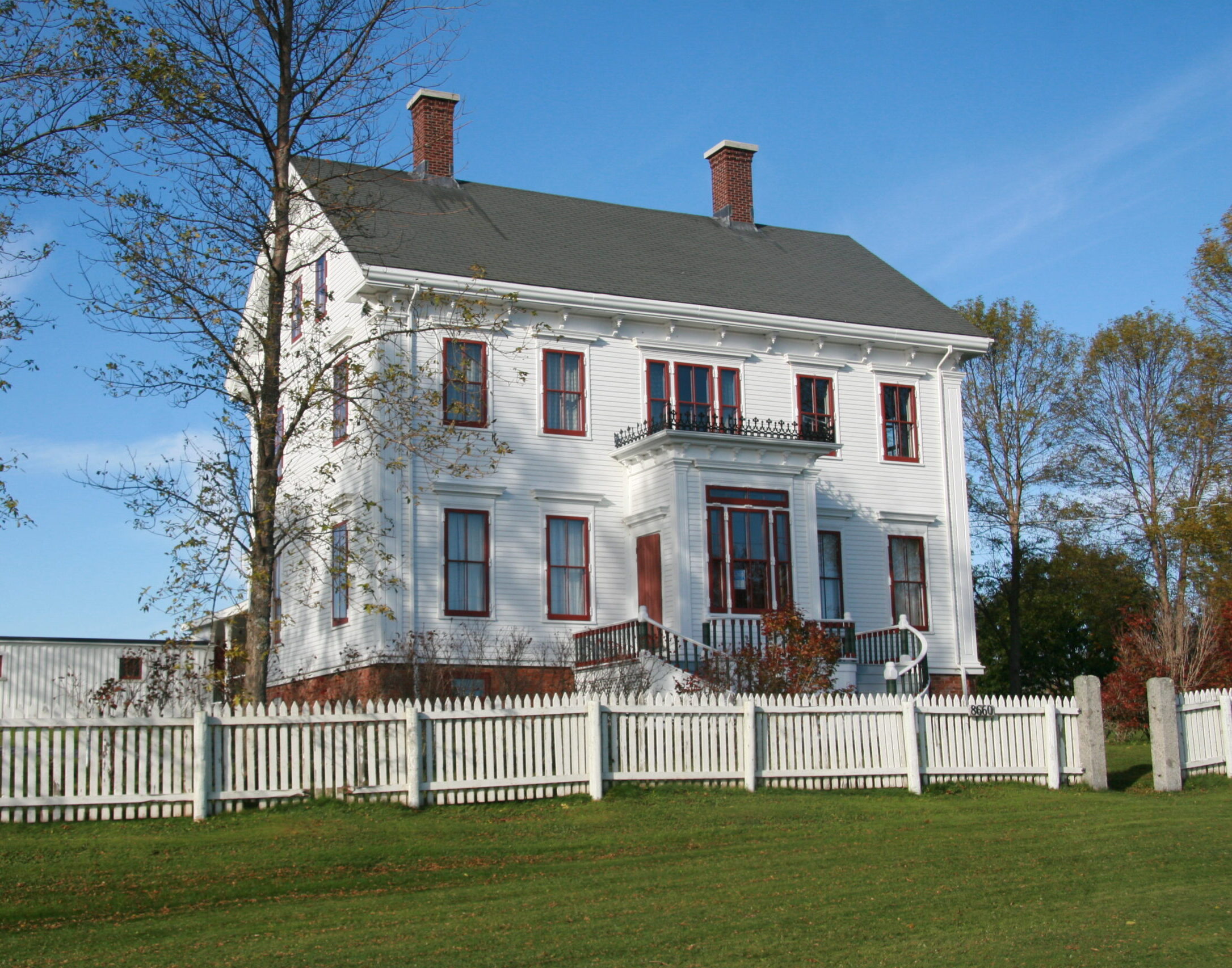 Lawrence House Museum - a large white building with red trim