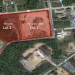 Thumbnail of http://Aerial%20view%20of%20a%20portion%20of%20the%20Milford%20Industrial%20Park,%20with%202%20large%20lots%20shaded%20in%20red,%20Lot%202%20to%20the%20left%20and%20Lot%201%20to%20the%20right.