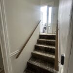 Thumbnail of http://Stairway%20with%20white%20walls%20to%20an%20entrance%20way.