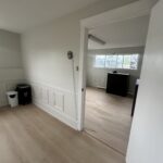 Thumbnail of http://Two%20office%20spaces%20with%20white%20walls%20and%20doorway.